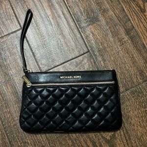 Black quilted wristlet. Barely used.